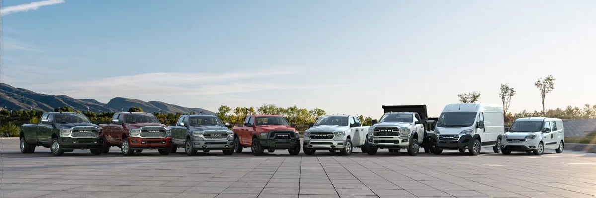 A lineup of six 2022 Ram trucks and two Ram vans